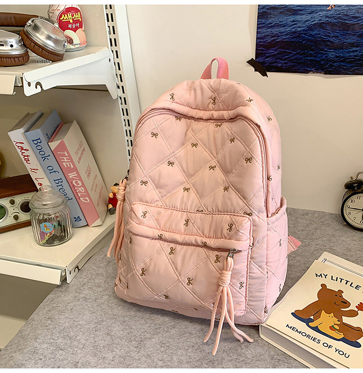 Quilted Backpack with Decorative Tassels