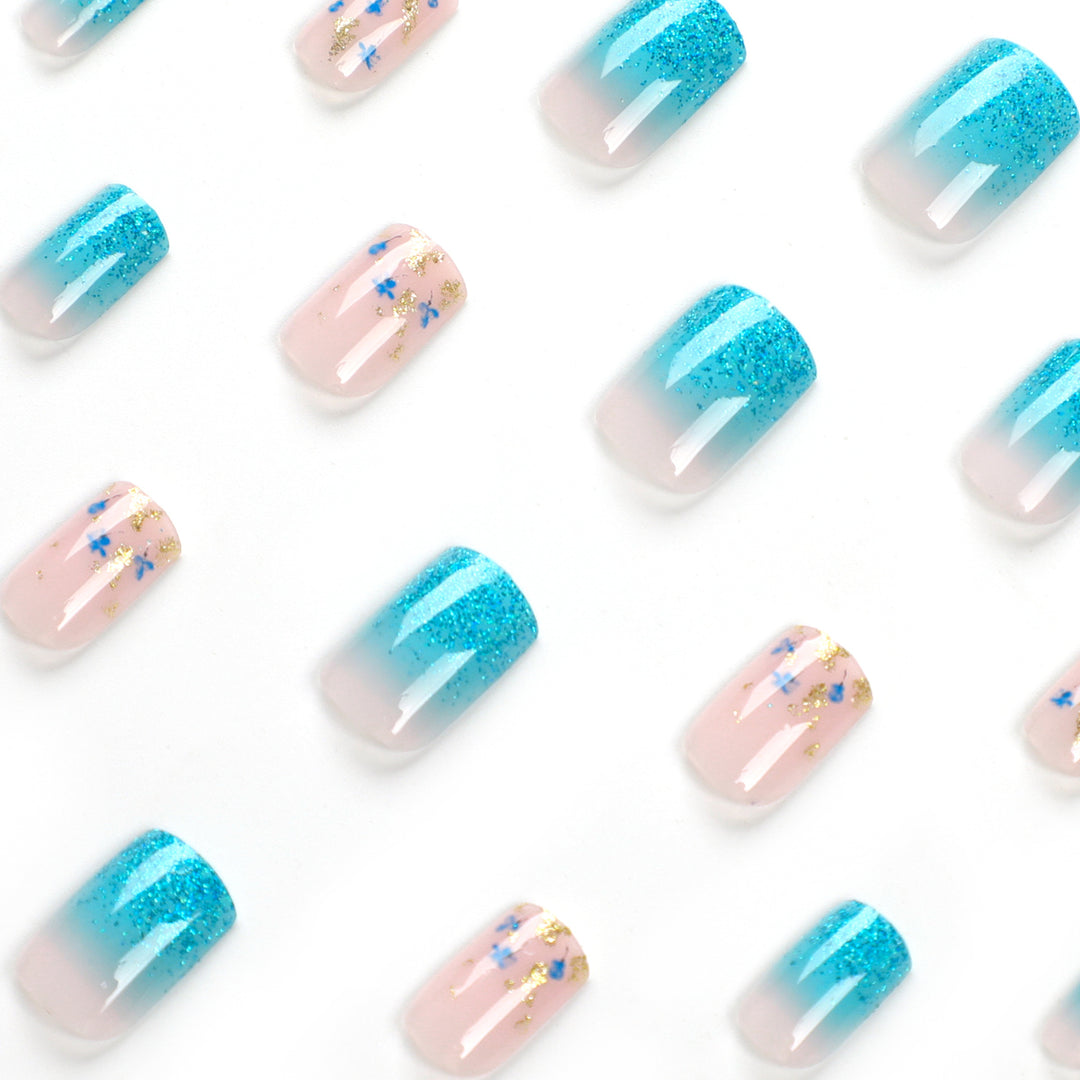 Artful acrylic nails with floral design and glitter effects Bowlift