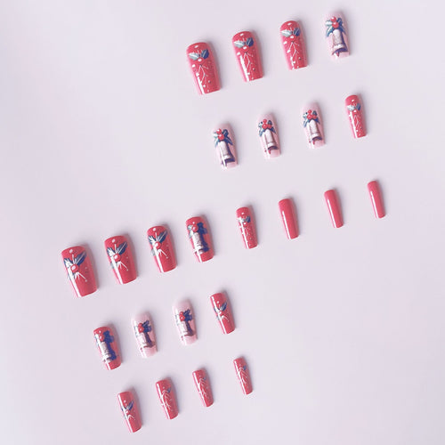 Artificial nail set with festive Christmas design and glitter details Bowlift