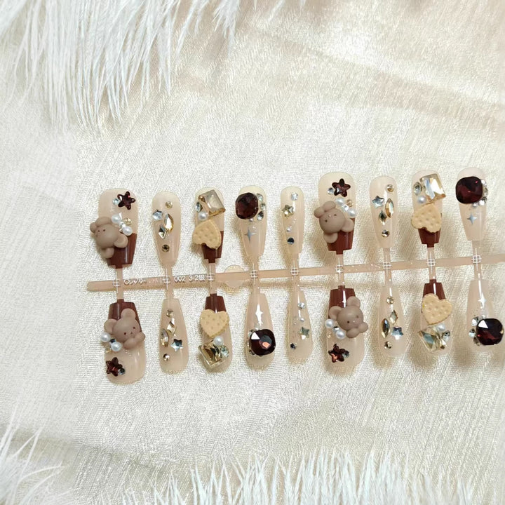 Creative acrylic nails with animal motifs and glitter accents Bowlift