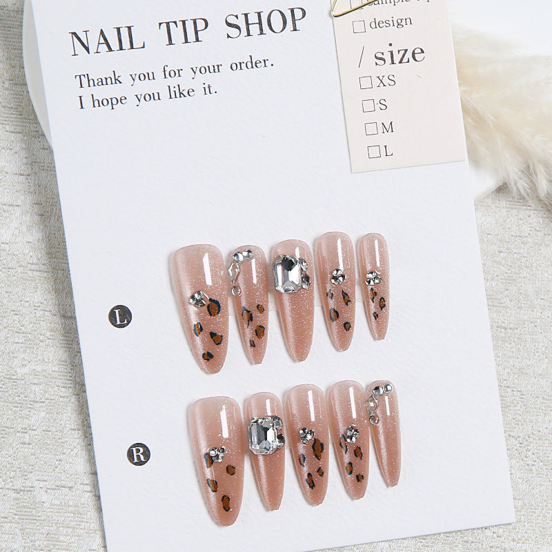 Glamorous artificial nail set with fun leopard pattern and glittering accents Bowlift