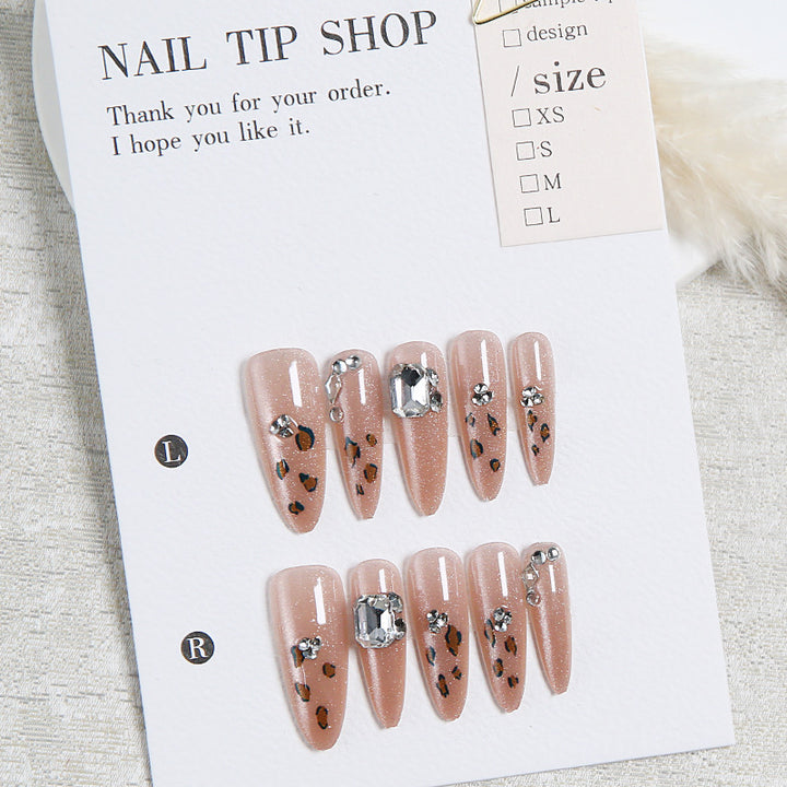 Glamorous artificial nail set with fun leopard pattern and glittering accents Bowlift