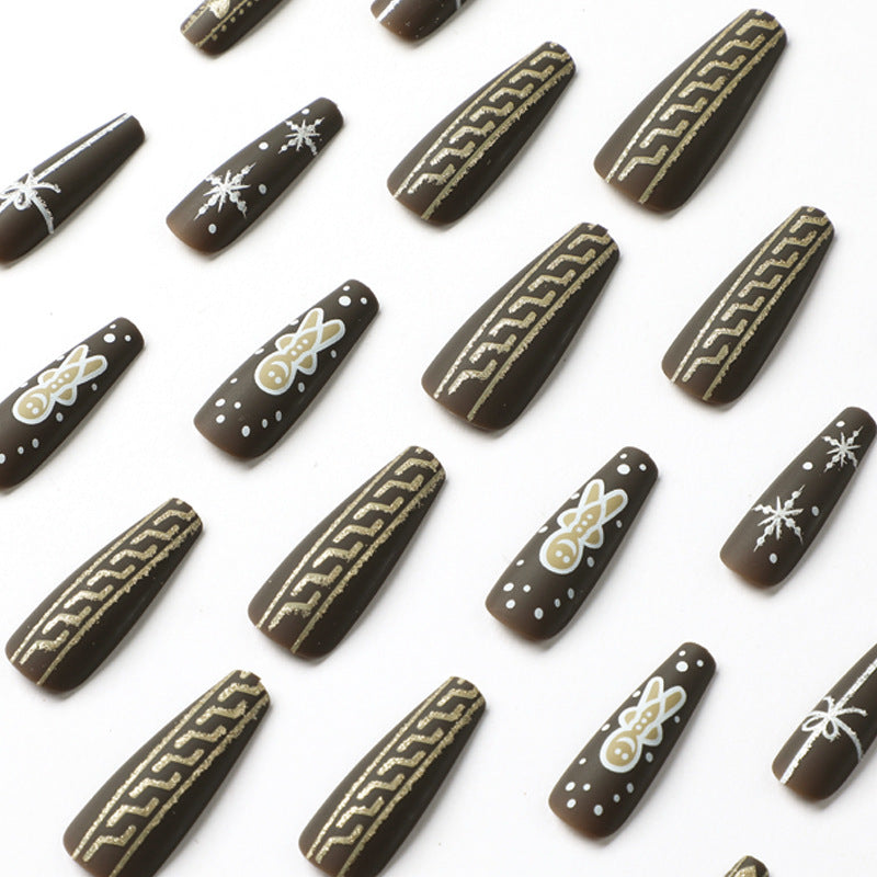 Artificial nail art with festive gingerbread design Bowlift