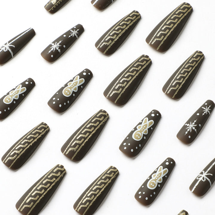 Artificial nail art with festive gingerbread design Bowlift
