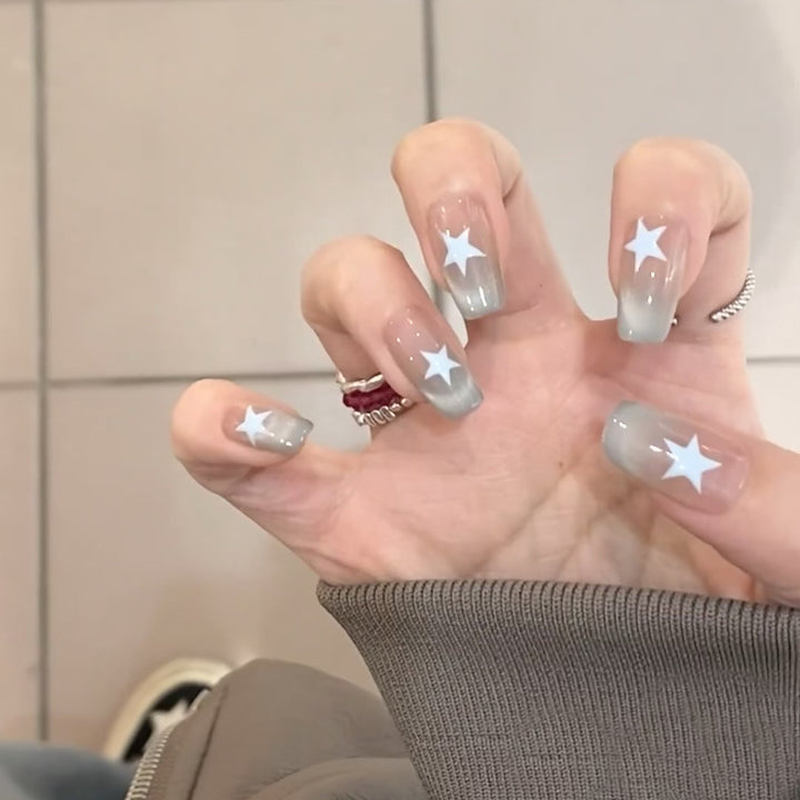 Artificial fingernails with star motif and ombre effect Bowlift
