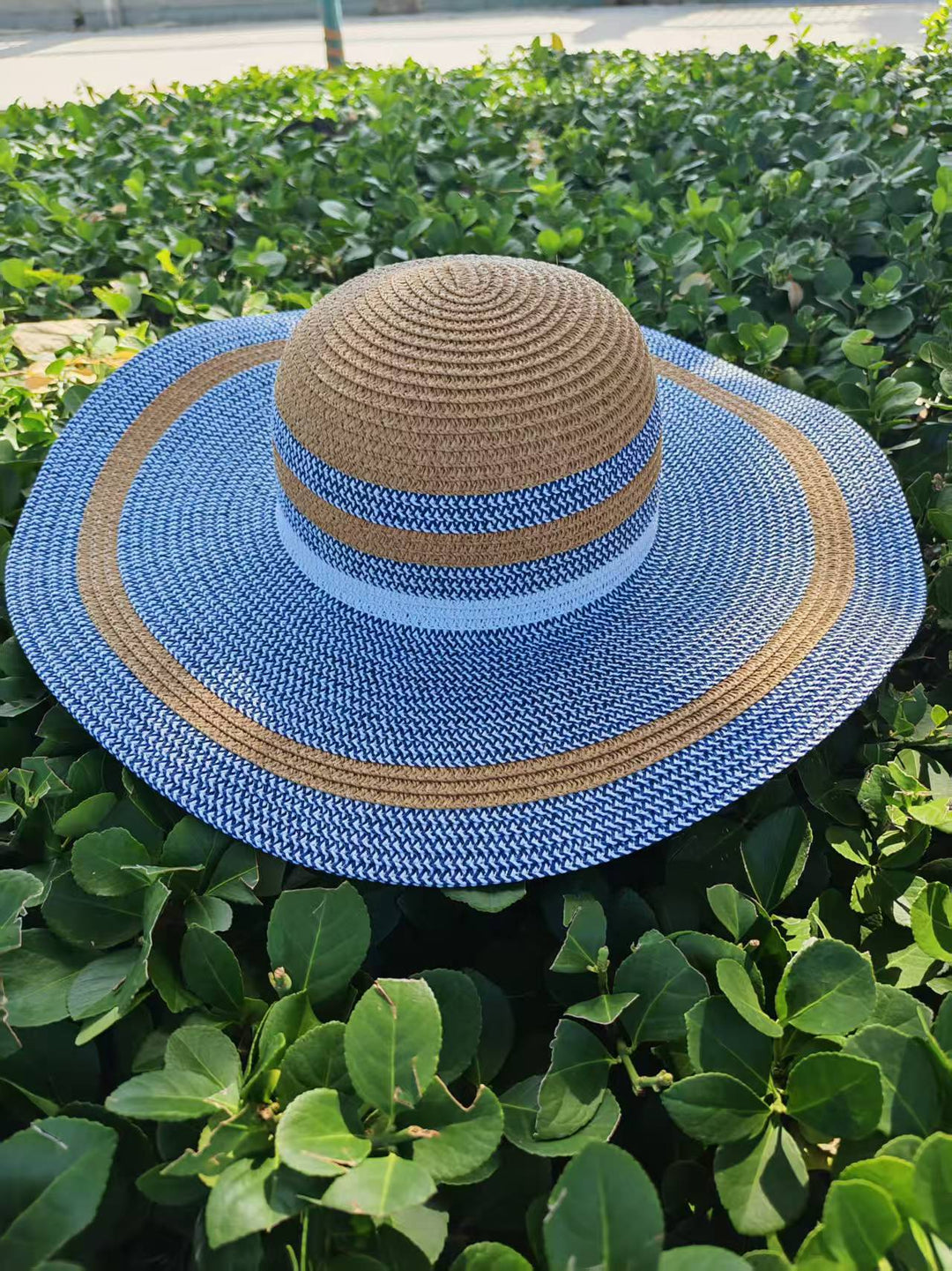 Elegant sun hat with wide brim and subtle stripe pattern Bowlift