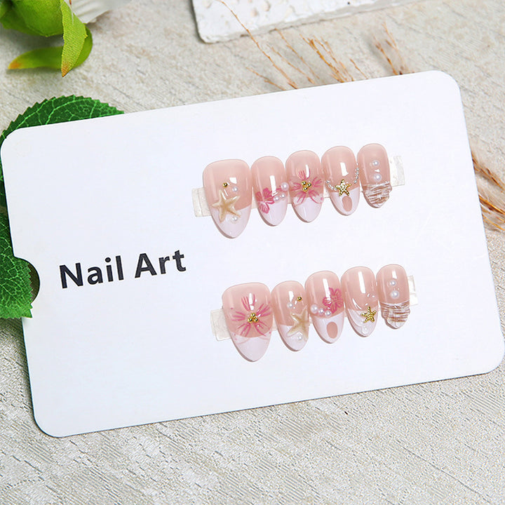 Elegant artificial nails with floral designs and glitter accents Bowlift