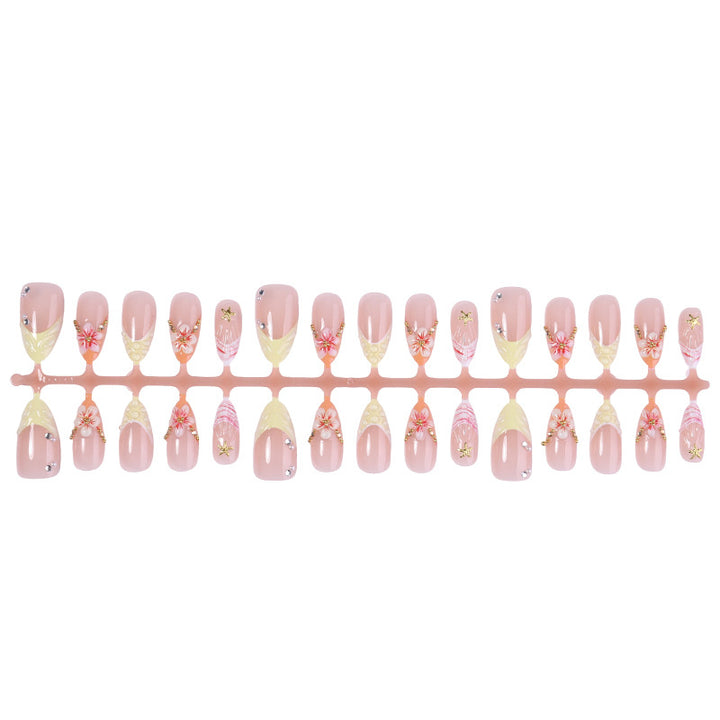 Artificial nail set with glamorous floral and glitter decorations Bowlift
