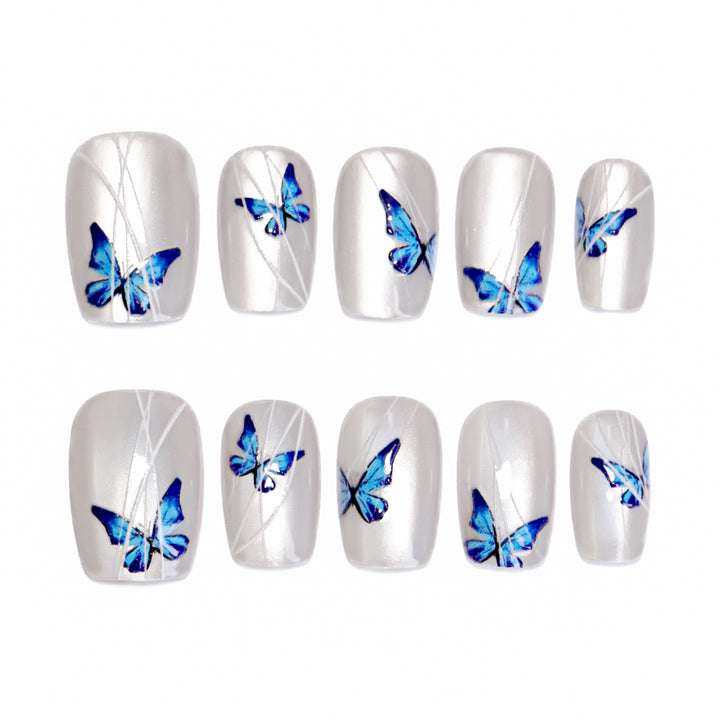 Creative nail extensions with intricate butterfly design Bowlift