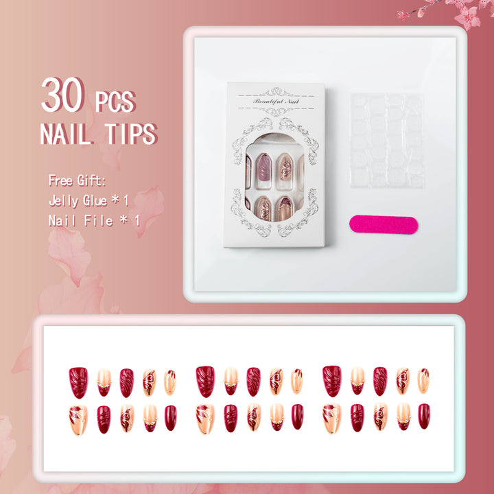 Artificial nail set with filigree golden decorations and romantic heart details Bowlift