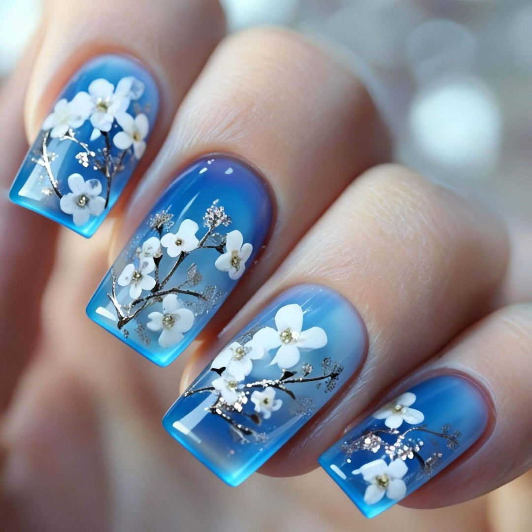 Artificial nail set with floral designs and glitter accents Bowlift