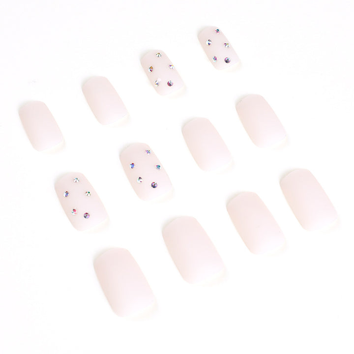 Artistic nail art with elegant rhinestone embellishments Bowlift