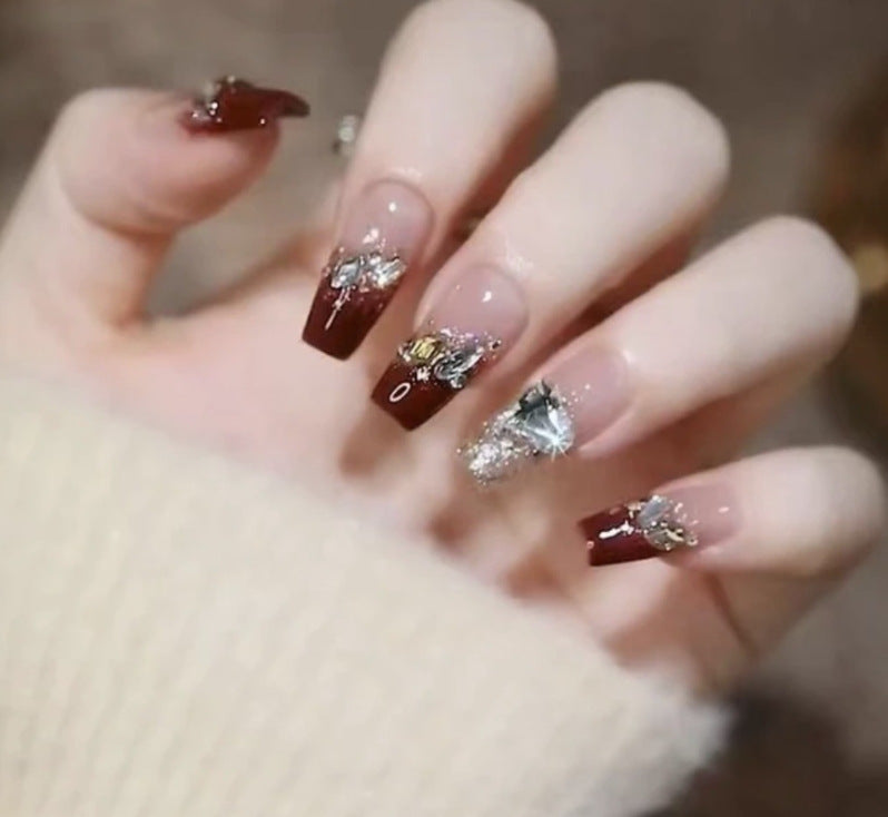 Artistic Nail Art with Glitter and Flower Applications Bowlift