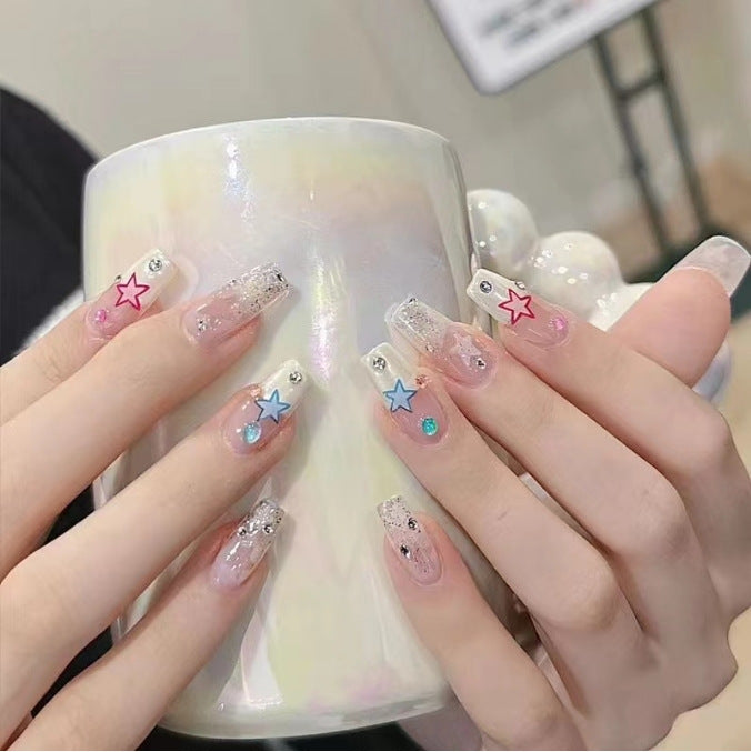 Artistic Nail Art with Glitter and Flower Applications Bowlift
