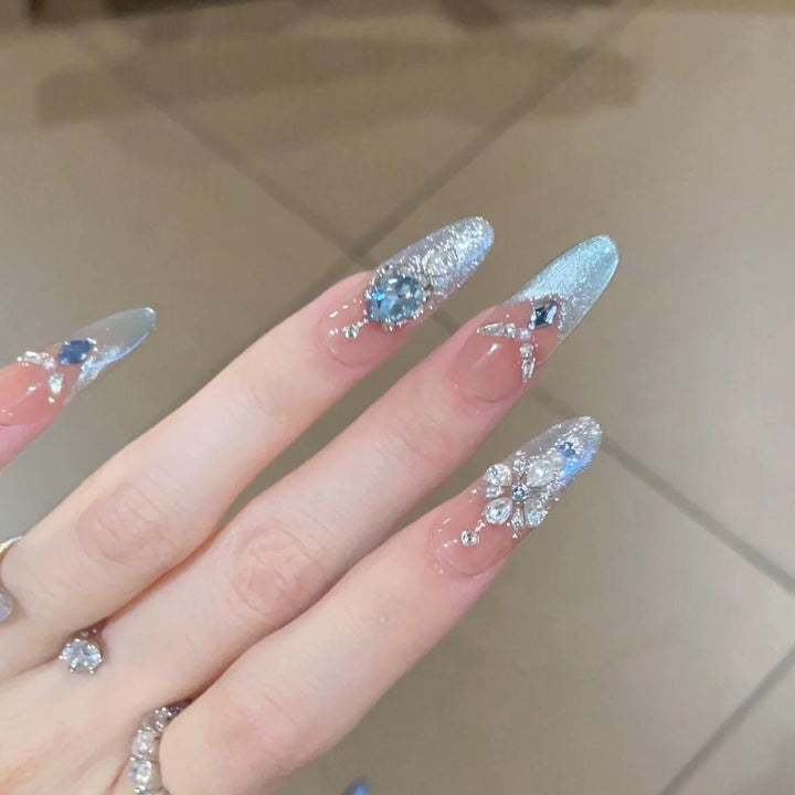 Glamorous artificial nails with sparkling rhinestone accents Bowlift