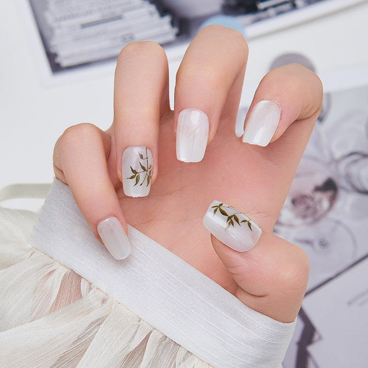 Artistic nail extensions with floral accents Bowlift