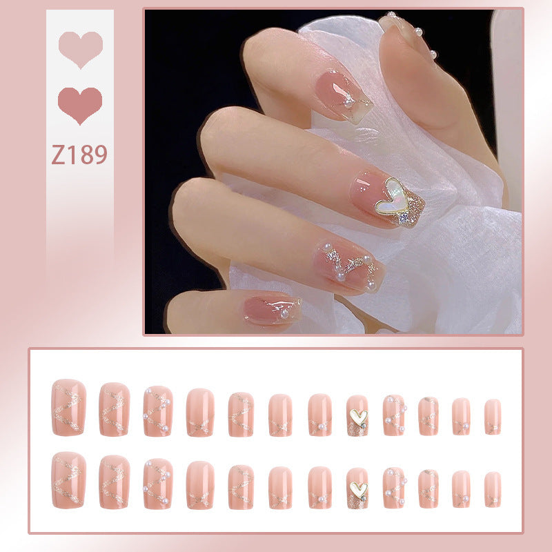 Nail art set with elegant wave patterns and delicate pearl accents Bowlift