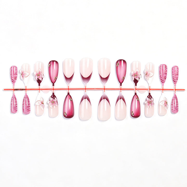 Artificial nail set with floral accents and ombre effect Bowlift