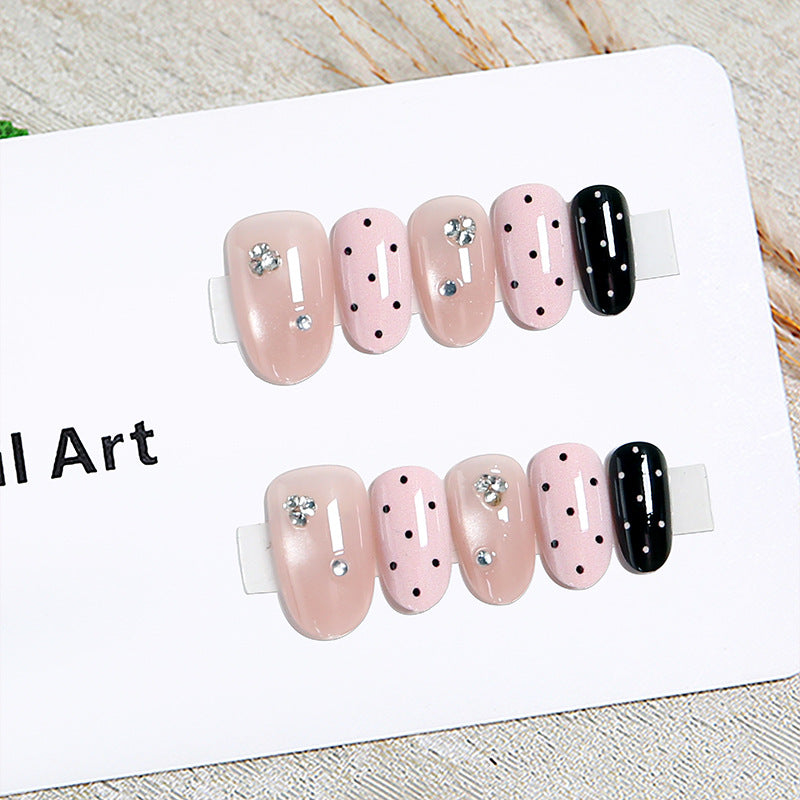 Acrylic nail set with glamorous rhinestone accents and modern dots Bowlift