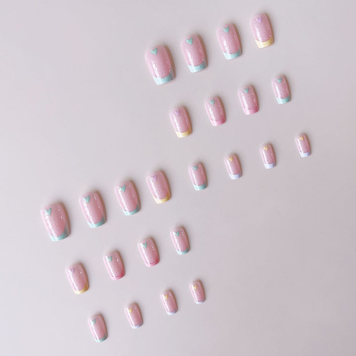 Artificial nail set with playful color gradients and heart motifs Bowlift