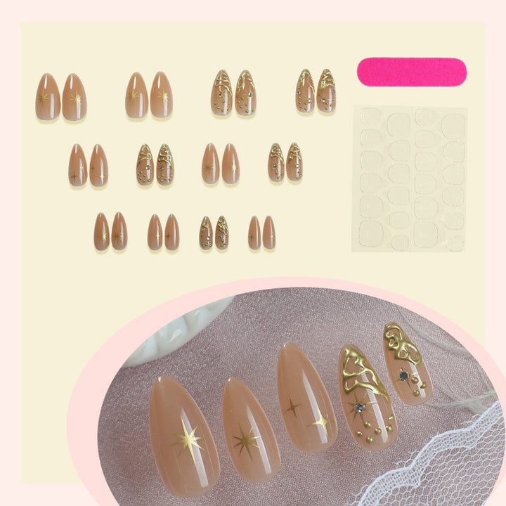 Creative nail set with elegant gold embellishments and sparkling accents Bowlift
