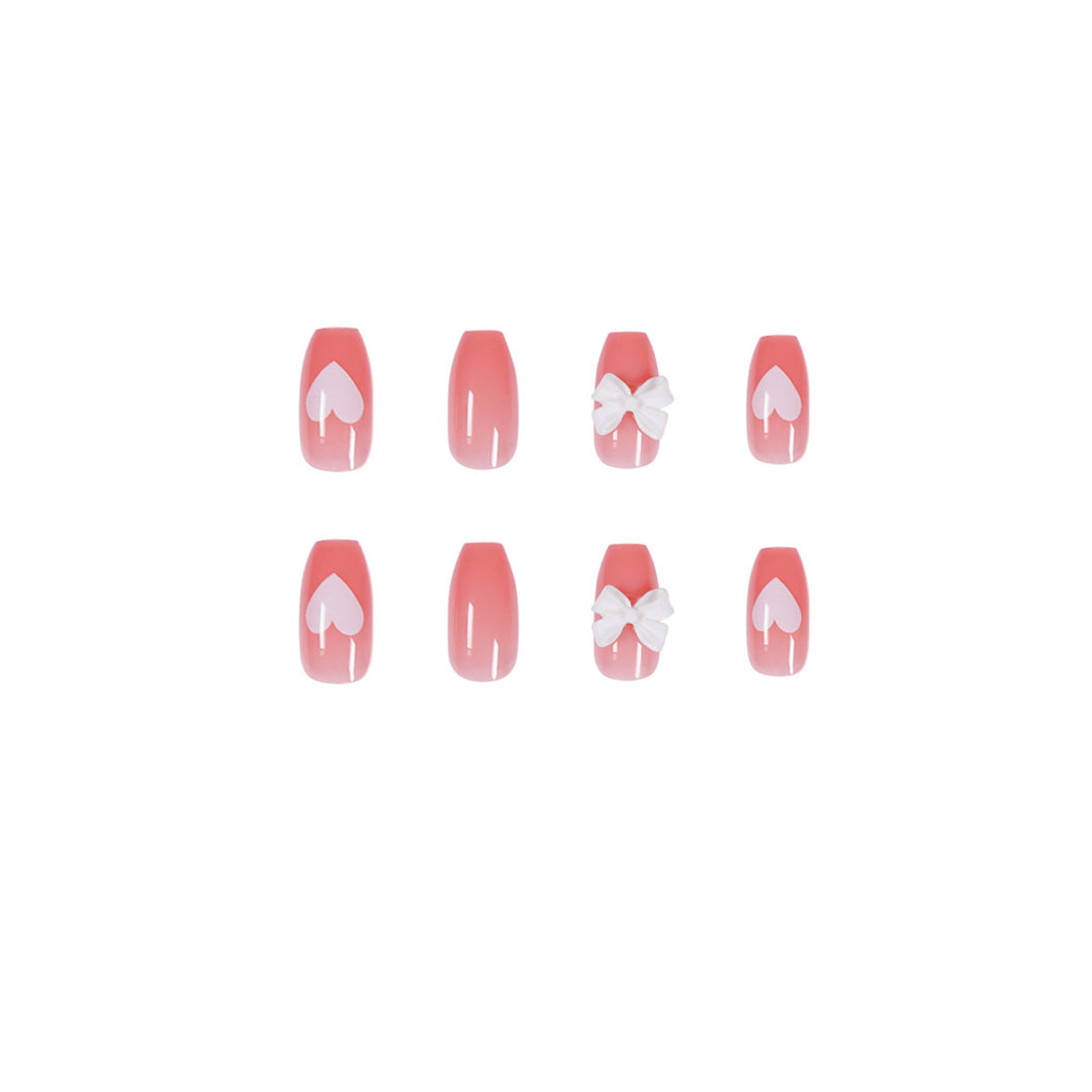 Artistic acrylic nails with heart and bow motifs Bowlift