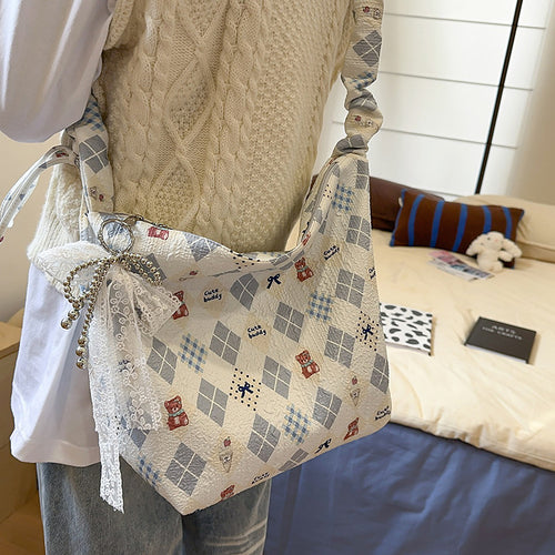 Playful Character-Themed Hobo Bag Bowlift