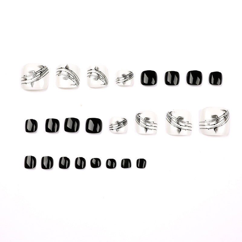 Artful toenail art in elegant black and white design Bowlift