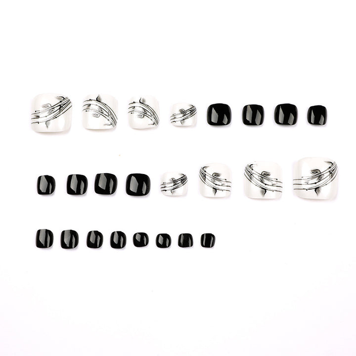 Artful toenail art in elegant black and white design Bowlift