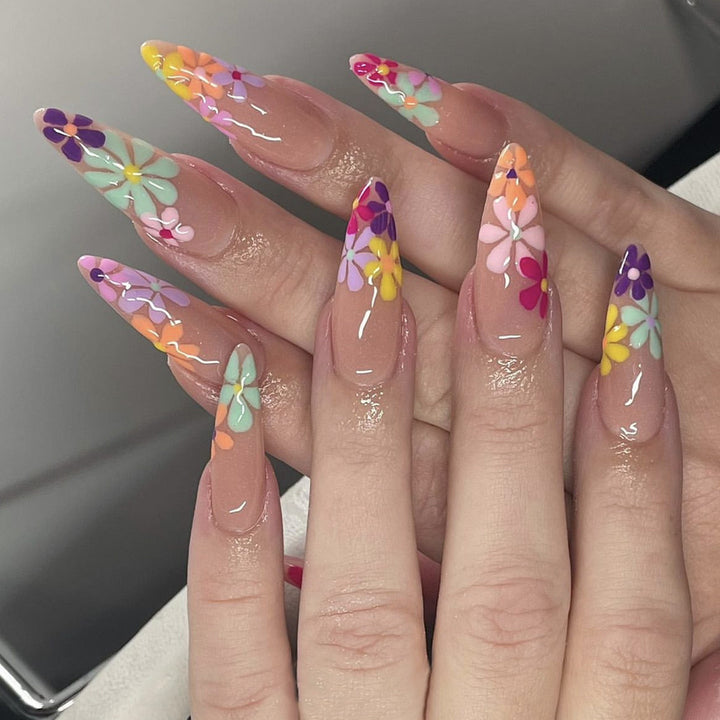 Acrylic nail set with vibrant floral designs and sharp accents Bowlift
