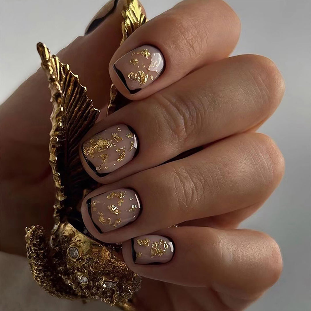 Artificial nail set with delicate gold accents and elegant finish Bowlift