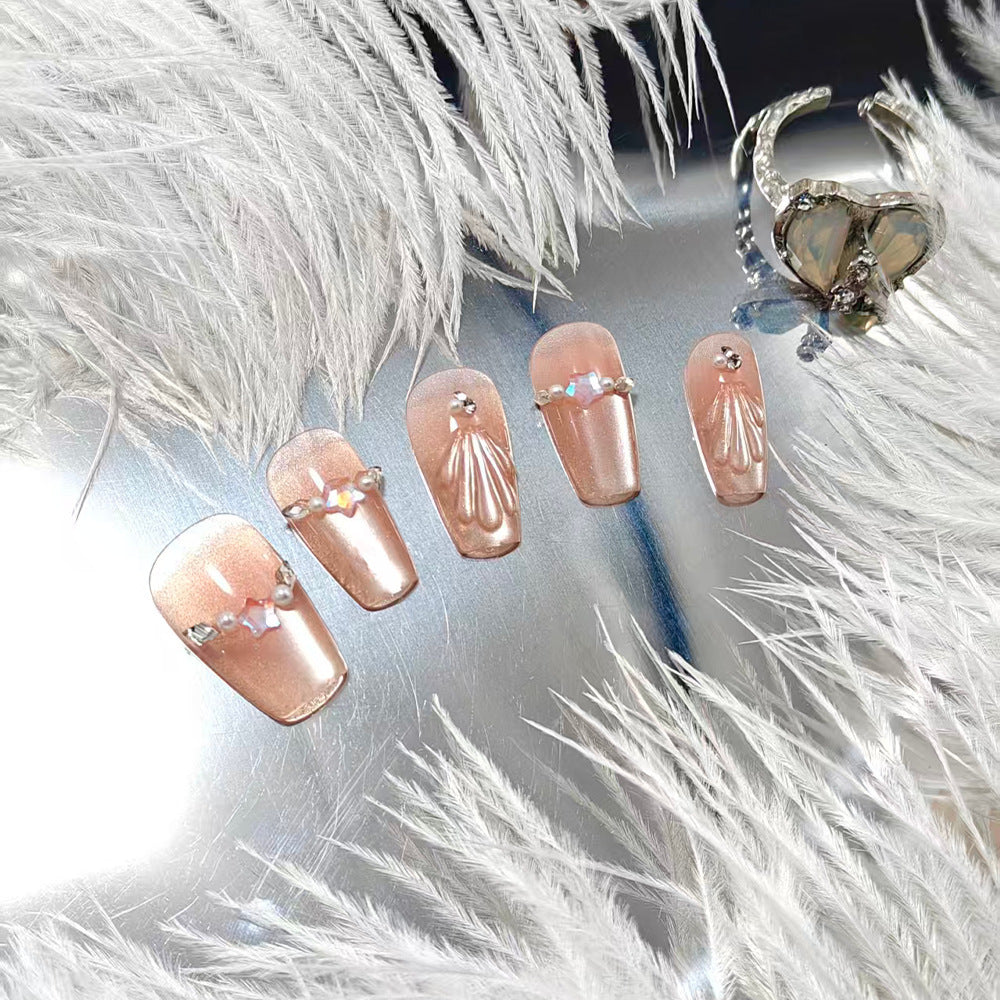 Elegant artificial nails with pearl and rhinestone embellishments Bowlift