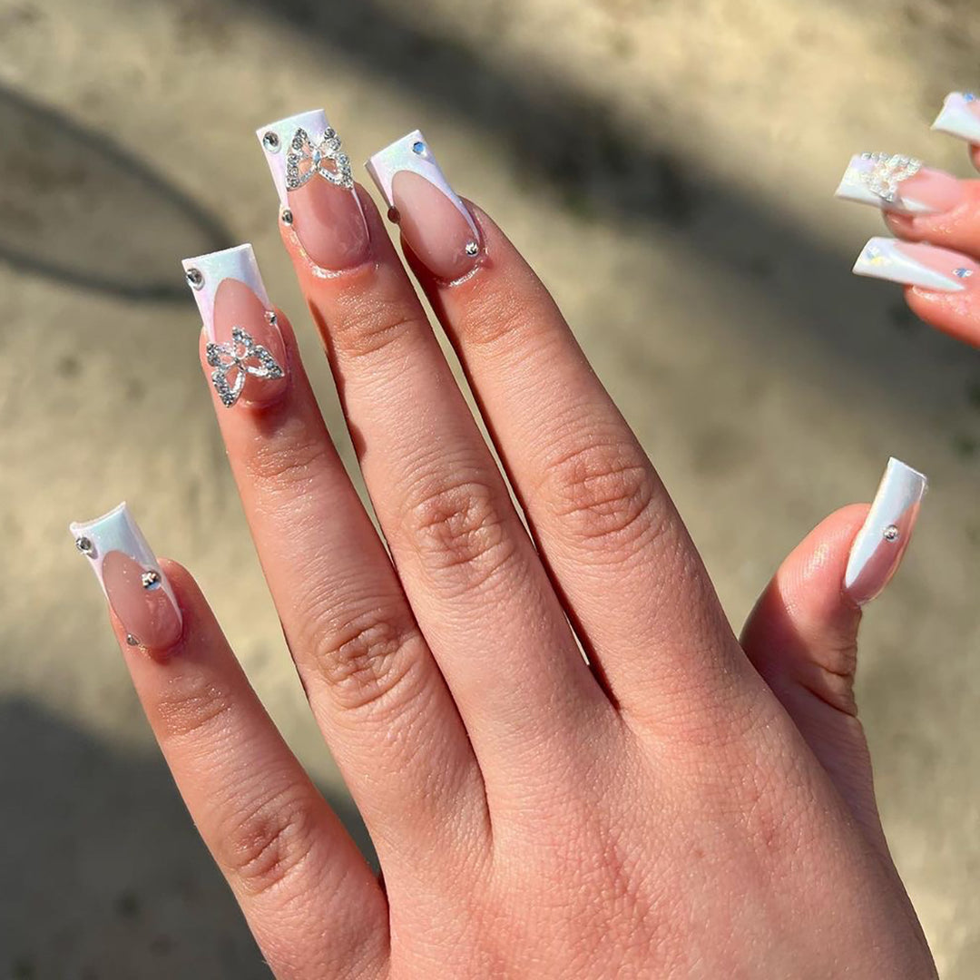 Elegant Nail Art with Glitter and Floral Accents Bowlift