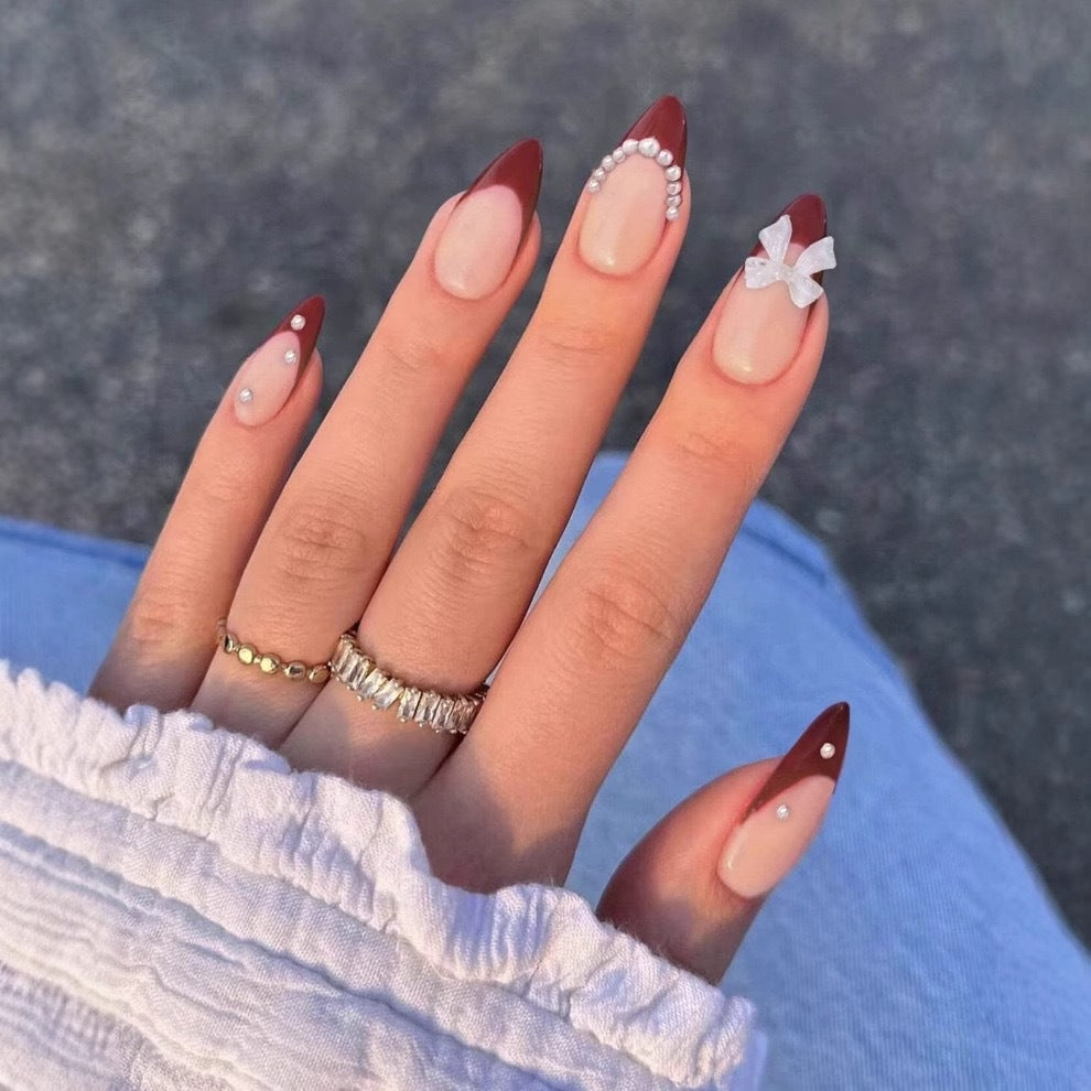 Artificial nail set with glamorous rhinestone and bow decorations Bowlift