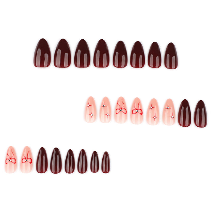 Artful nail art with elegant bows and rhinestone embellishments Bowlift