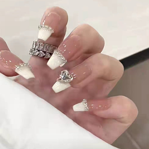 Glamorous artificial nails with rhinestones and elegant contours Bowlift
