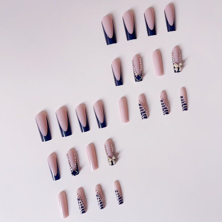 Glamorous artificial nails with elegant design with rhinestones and 3D decorations Bowlift