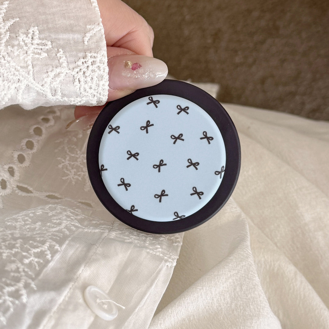 Decorative coaster with bow motif Bowlift