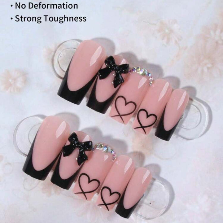 Acrylic nail set with elegant heart and bow design Bowlift