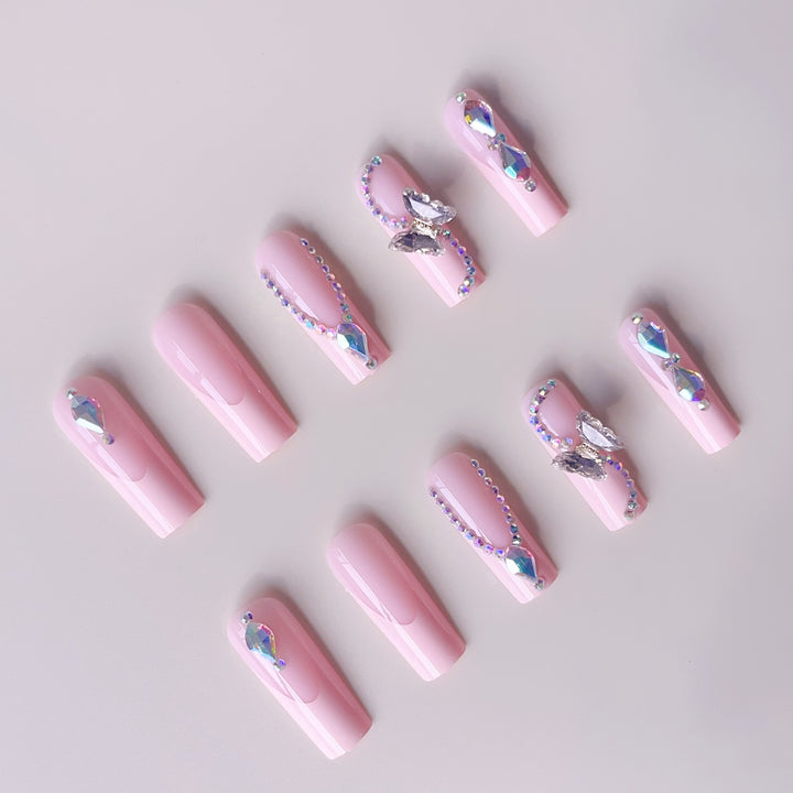 Acrylic nail set with elegant glitter and rhinestone accents Bowlift