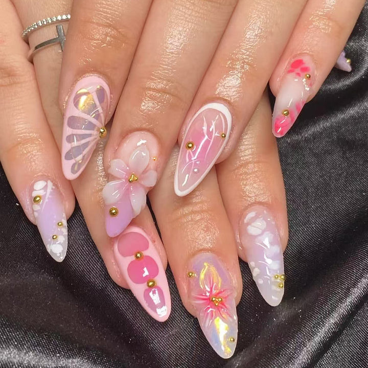 Artful Nail Extensions with Floral Patterns and Rhinestone Embellishments Bowlift