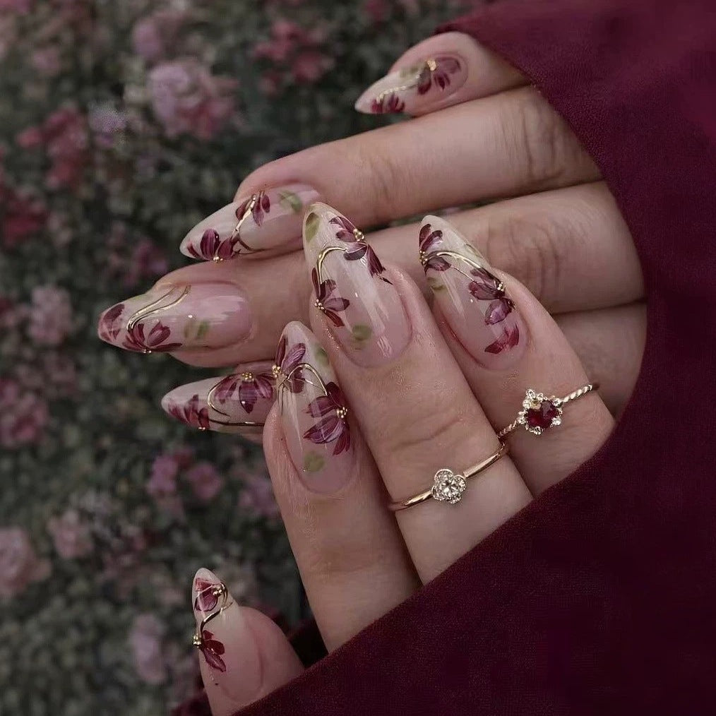 Artificial nail set with floral patterns and golden accents Bowlift