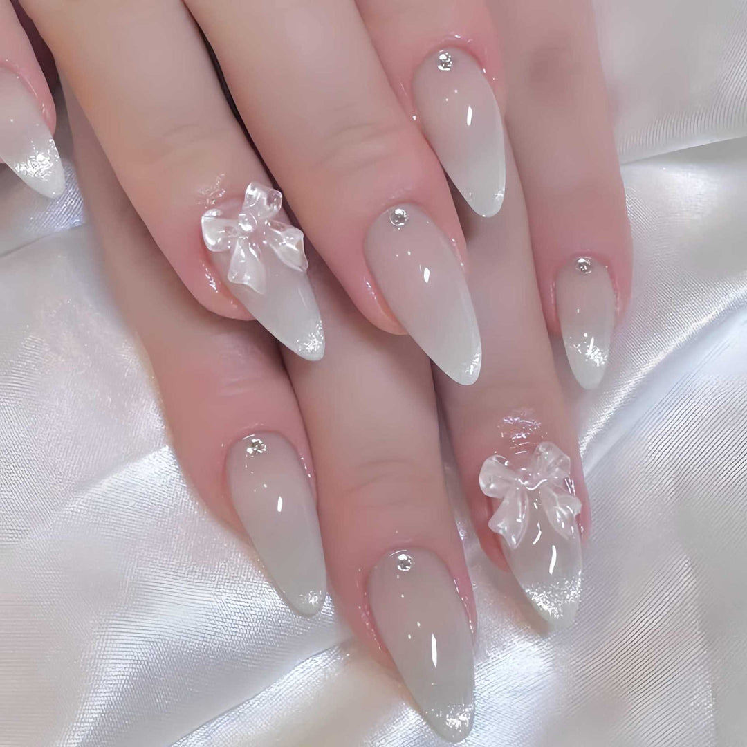 Elegant Stiletto-Shaped Press-On Nails with Decorative Bow Accents Bowlift