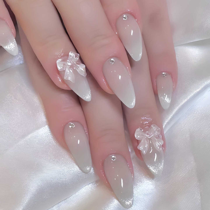 Elegant Stiletto-Shaped Press-On Nails with Decorative Bow Accents Bowlift