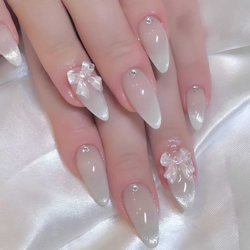Elegant Stiletto-Shaped Press-On Nails with Decorative Bow Accents Bowlift