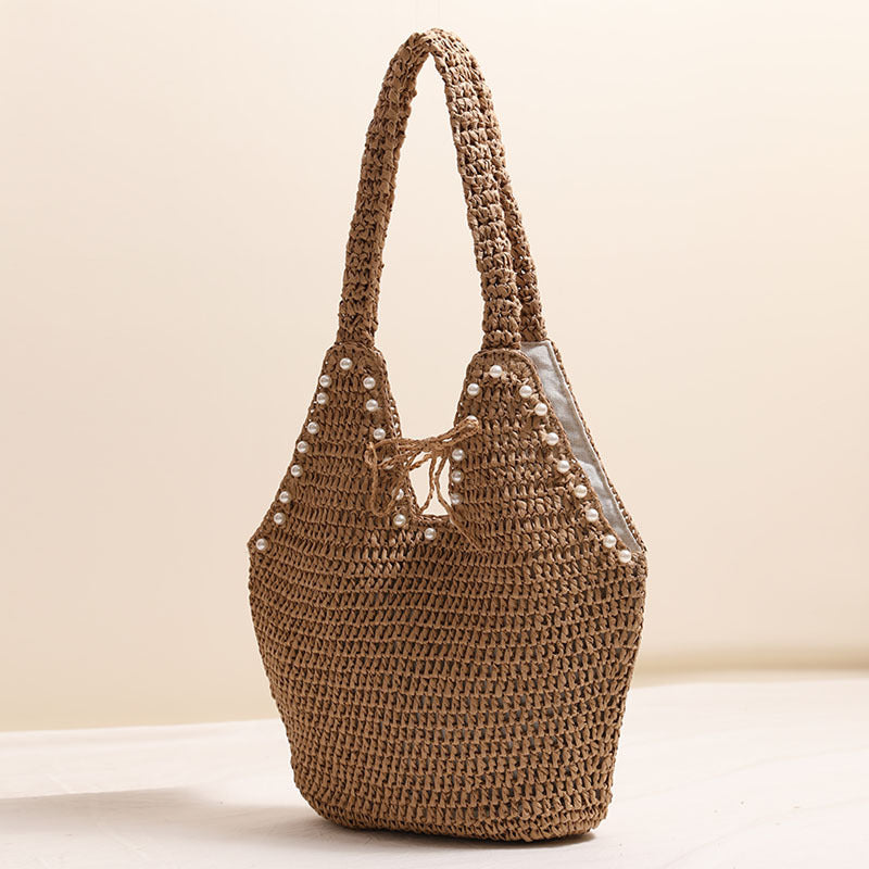Handbag with pearl decor and innovative closure Bowlift