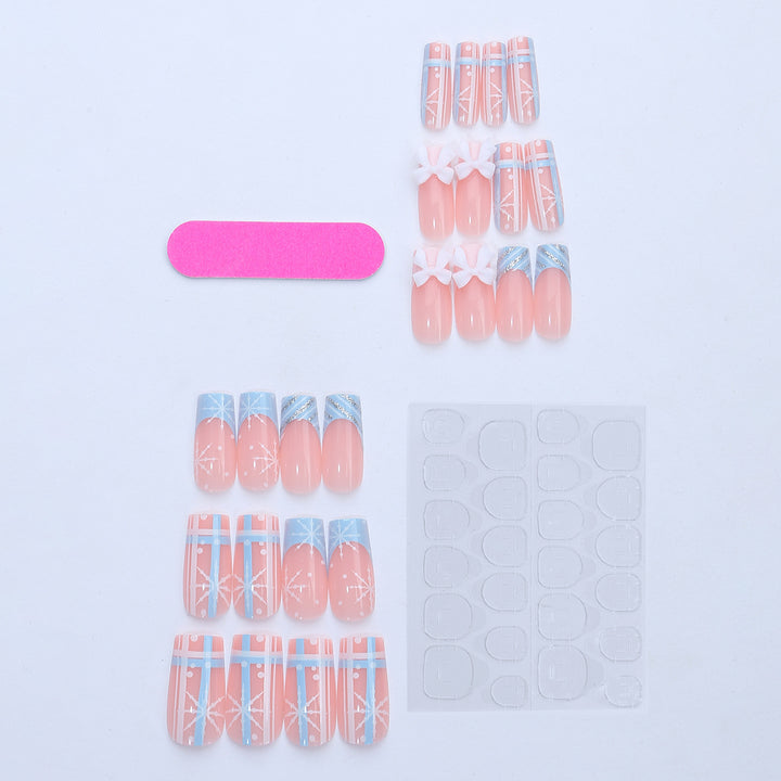 Artificial nail set with winter snowflake and bow motifs Bowlift