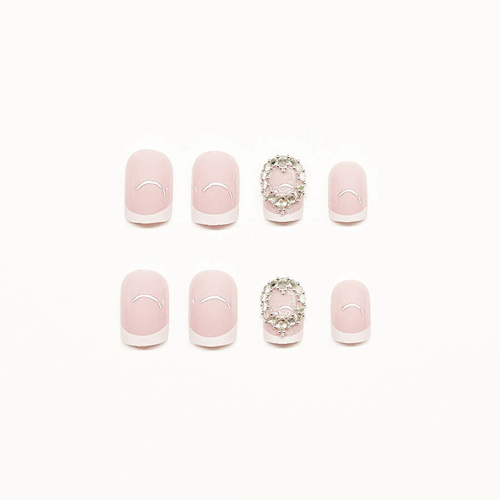 Artificial nail set with elegant French design and rhinestone embellishments Bowlift