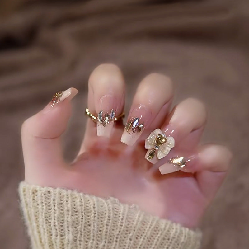 Glamorous artificial nails with delicate flower and glitter effects Bowlift