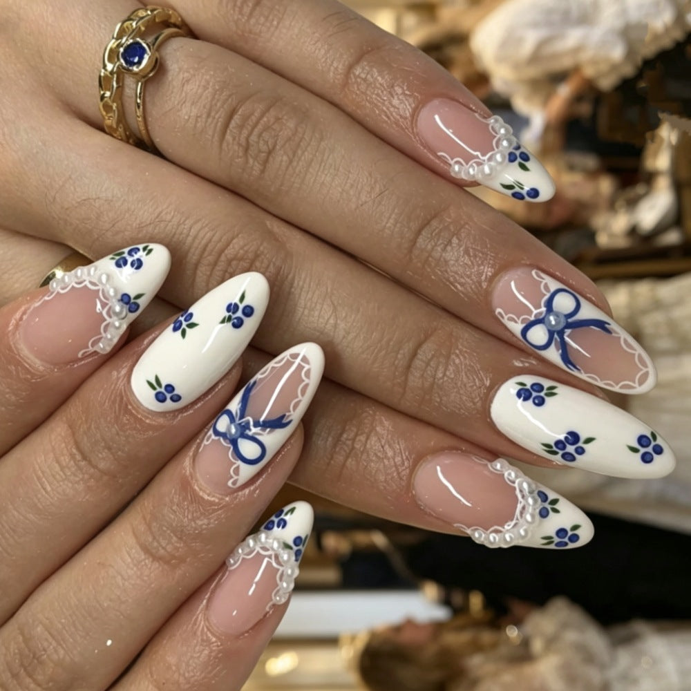 Artistic Press-On Nail Set with Celestial Design Bowlift